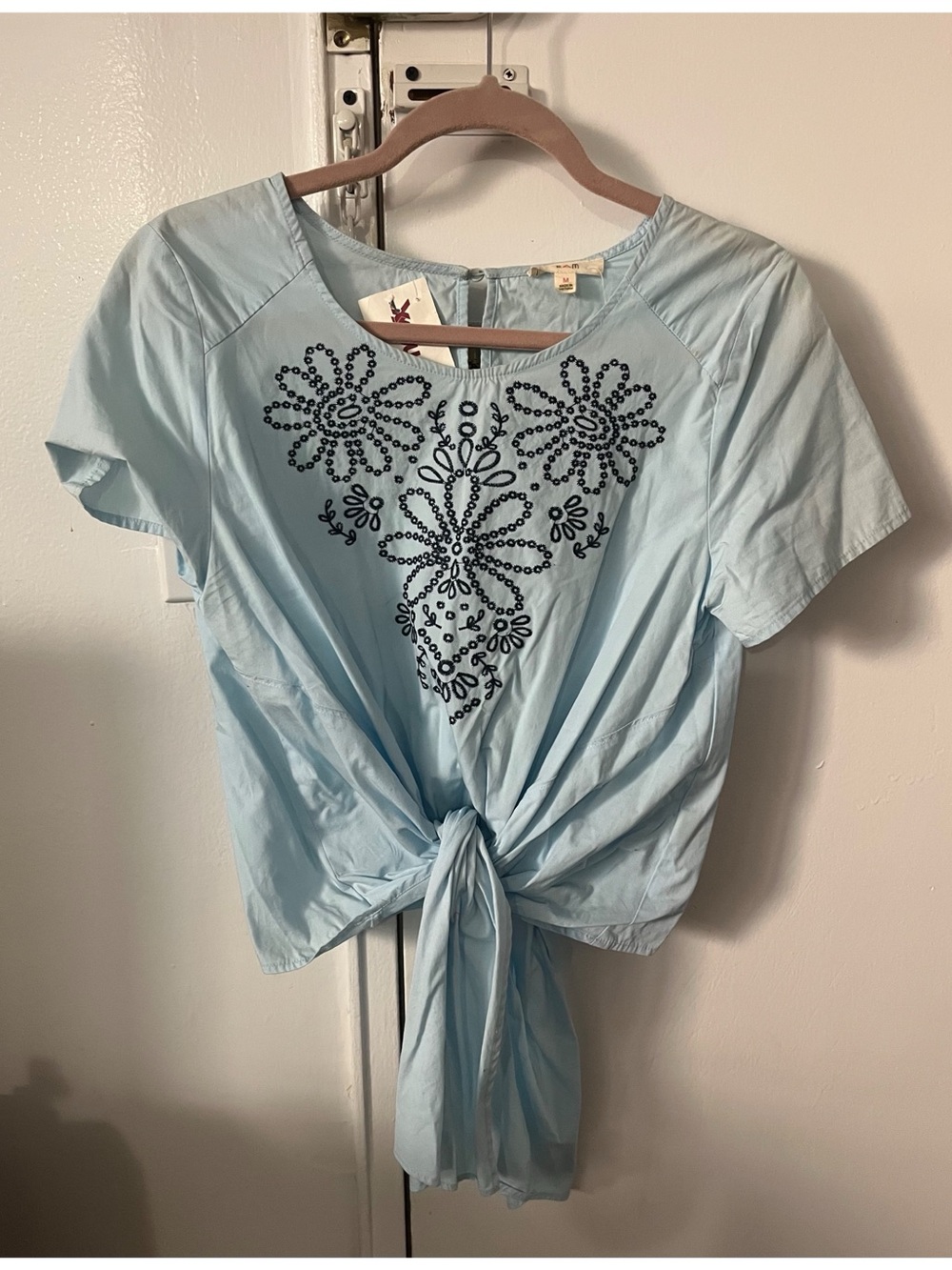 E M blue tie front blouse with floral embroidery, size M